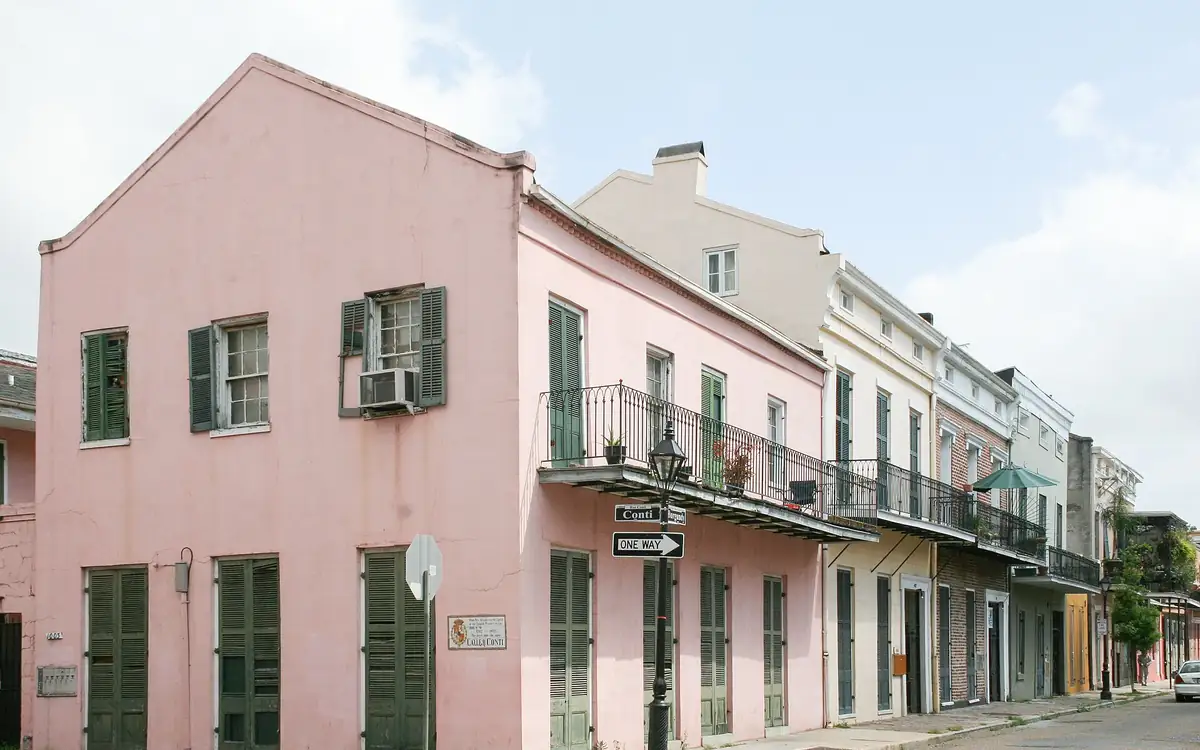 Pastel houses with iron balconies on Burgundy Street in the French Quarter