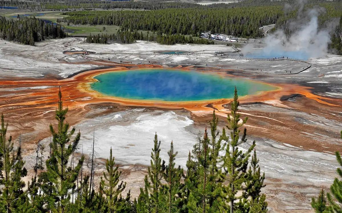 Grand Prismatic Spring in Yellowstone with steam and orange mats